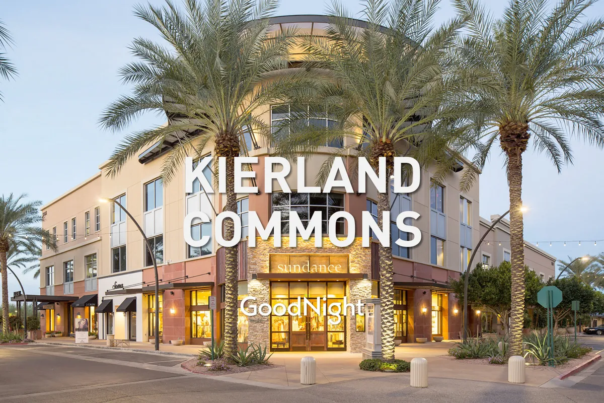 A lively exterior scene with palm trees, local storefronts, and visible signage, evoking the vibrant atmosphere of nearby shops and dining options. The setting is open and welcoming, suggesting the accessibility of local flavors and social spots.